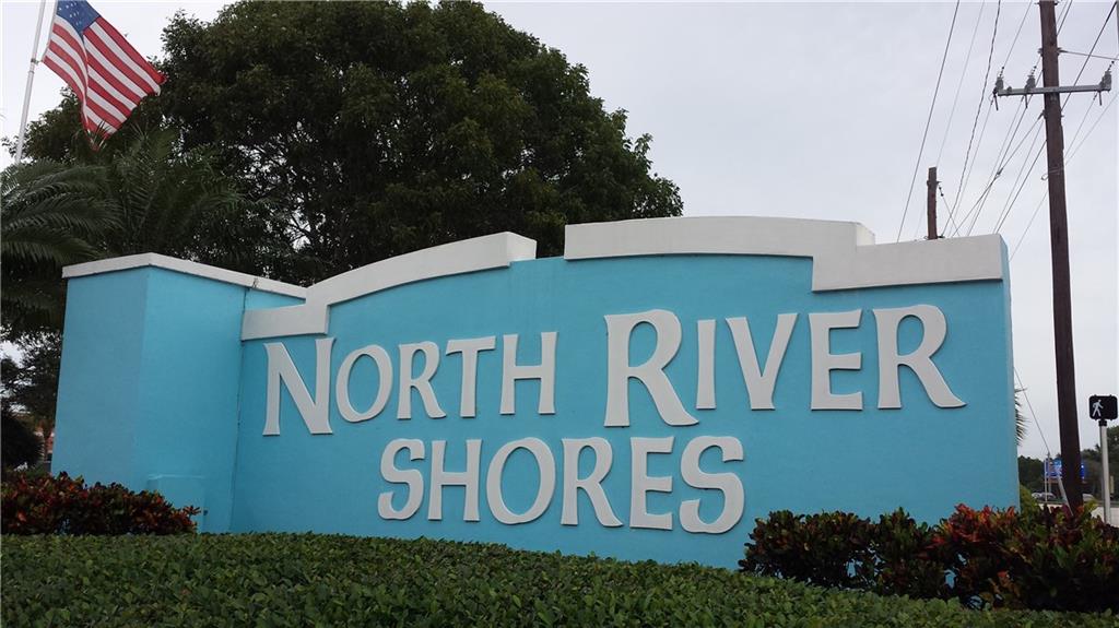 1153 Northwest Spruce Ridge Drive Stuart, FL 34994 - Photo 22 of 22 a sign that is on the wall of the building