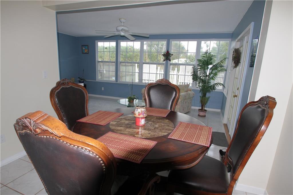1153 Northwest Spruce Ridge Drive Stuart, FL 34994 - Photo 5 of 22 a living room with furniture and a window