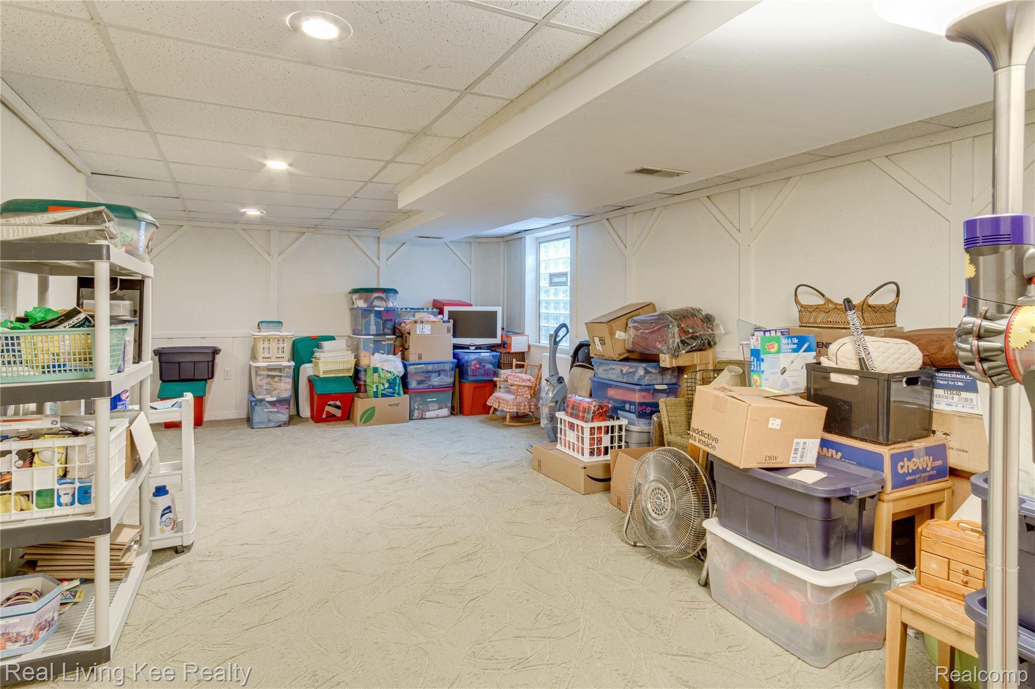 1590 Ravine Lane, Unit 171 Rochester, MI 48306 - Photo 16 of 22 A family room...kids play room...man-cave...or storage, This 21 x 13 area offers lots of flexibility.