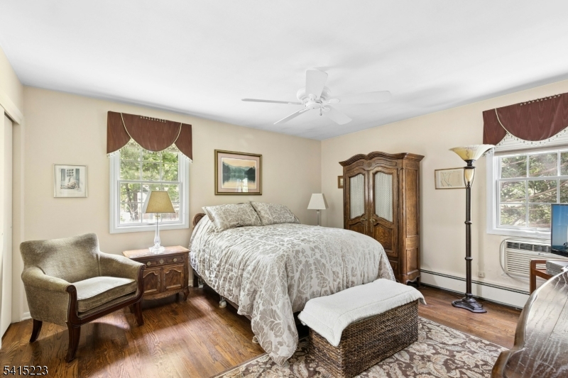33 Carol Road Westfield, NJ 07090 - Photo 14 of 23 a bedroom with a bed wooden floor and window