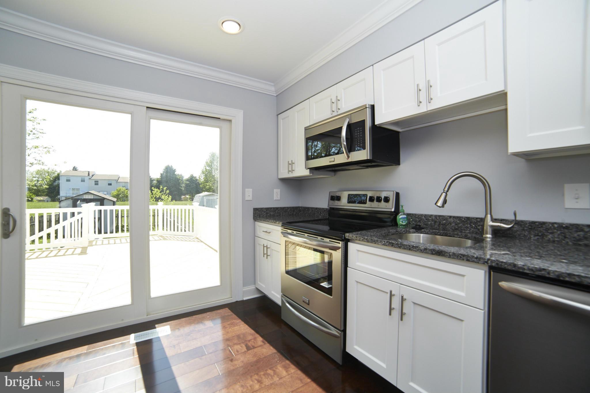 22 Bellfalls Way Baltimore, MD 21236 - Photo 3 of 30 New Deck through back Door