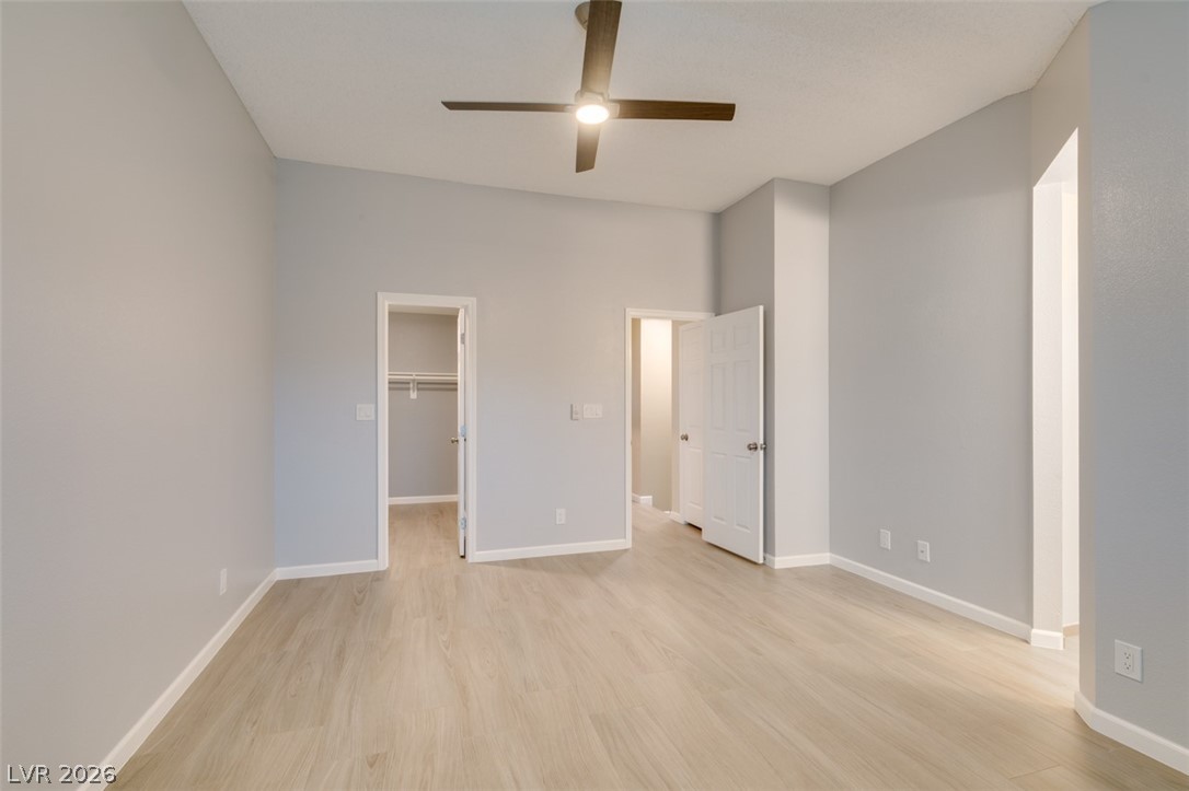 540 Sutters Mill Road Henderson, NV 89014 - Photo 42 of 46 This spacious room features vaulted ceilings and light wood flooring, offering a versatile living space.