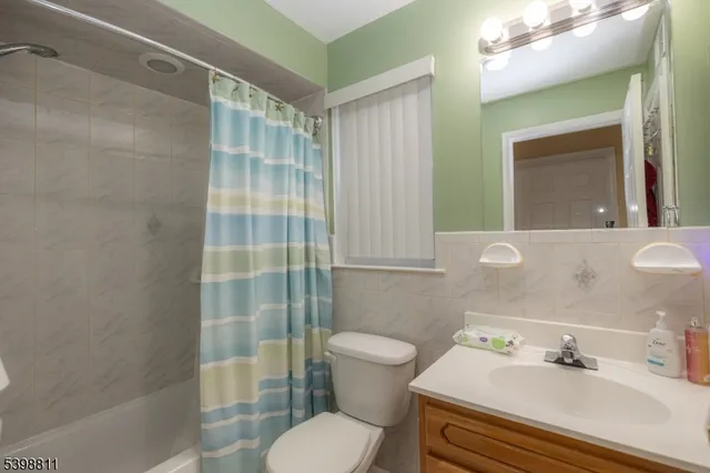 a bedroom with a bed and a desk