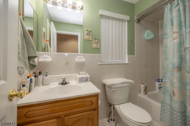 a living room with wooden floor and furniture