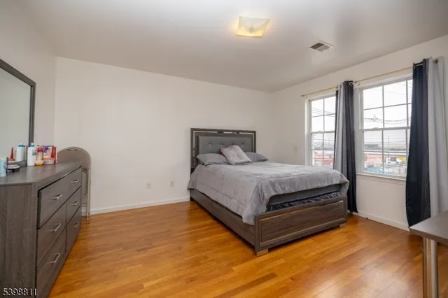 a large kitchen with stainless steel appliances granite countertop a lot of counter space and a sink