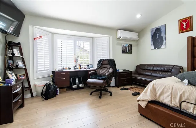a livingroom with workspace and a window