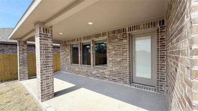 a view of a house with a door and wooden floor