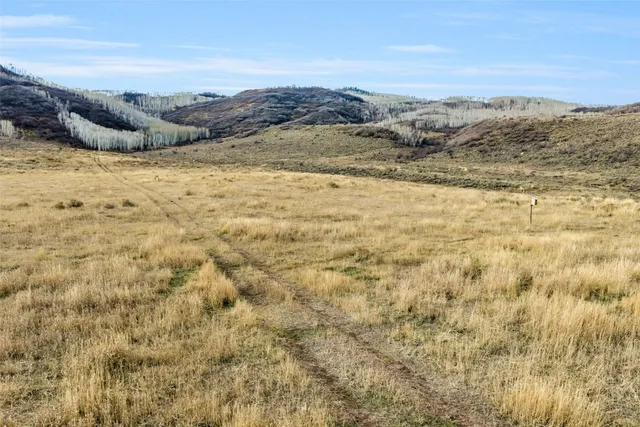 a view of ocean with a mountain