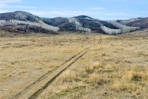 a view of an ocean and a mountain