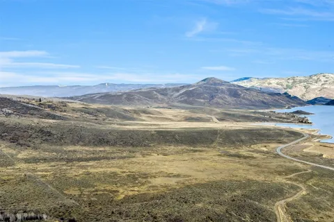 a view of a lake with mountains in the background