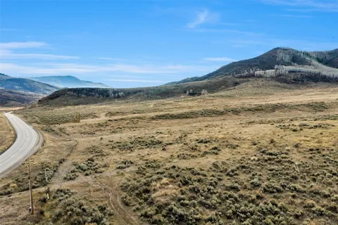 a view of ocean with a mountain