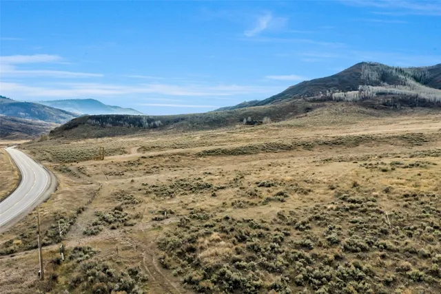 a view of ocean with a mountain