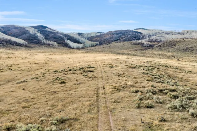 a view of an ocean from a mountain