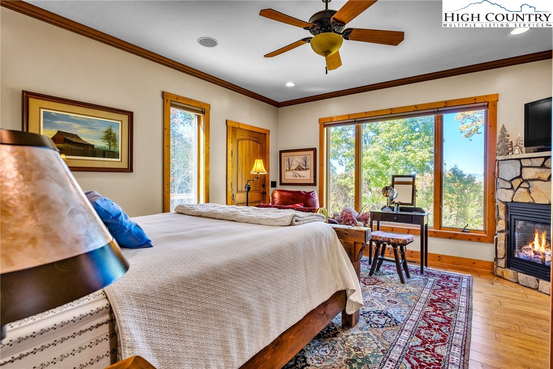 2650 Carson Woods Road Laurel Springs, NC 28644 - Photo 16 of 50 a bed room with a bed and glass door