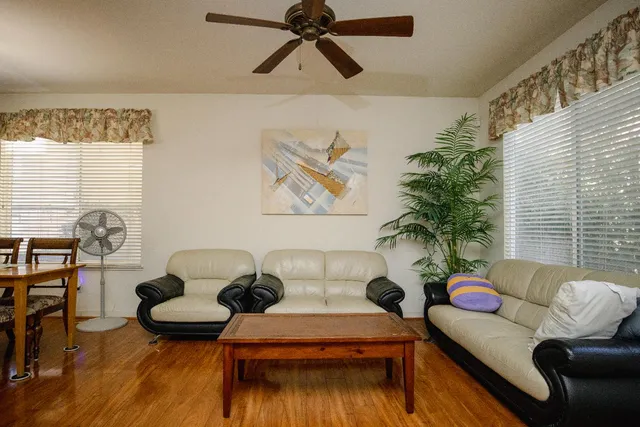 a living room with furniture and a large window