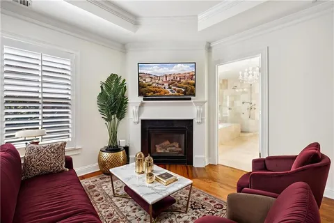 a living room with furniture a fireplace and window