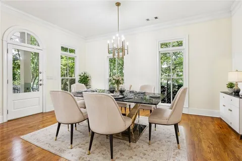 a view of a dining room with furniture window and wooden floor