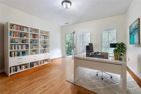 a room with furniture and a potted plant