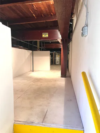 a view of a swimming pool with a lounge chair