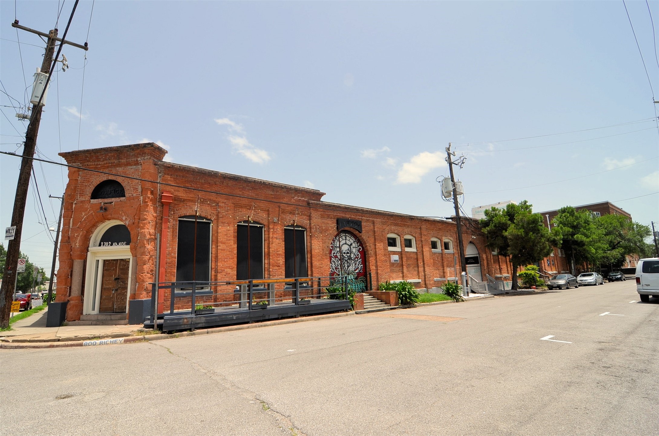1310 Nance Street, Unit A Houston, TX 77002 - Photo 15 of 18 a view of a building with cars parked and a garage