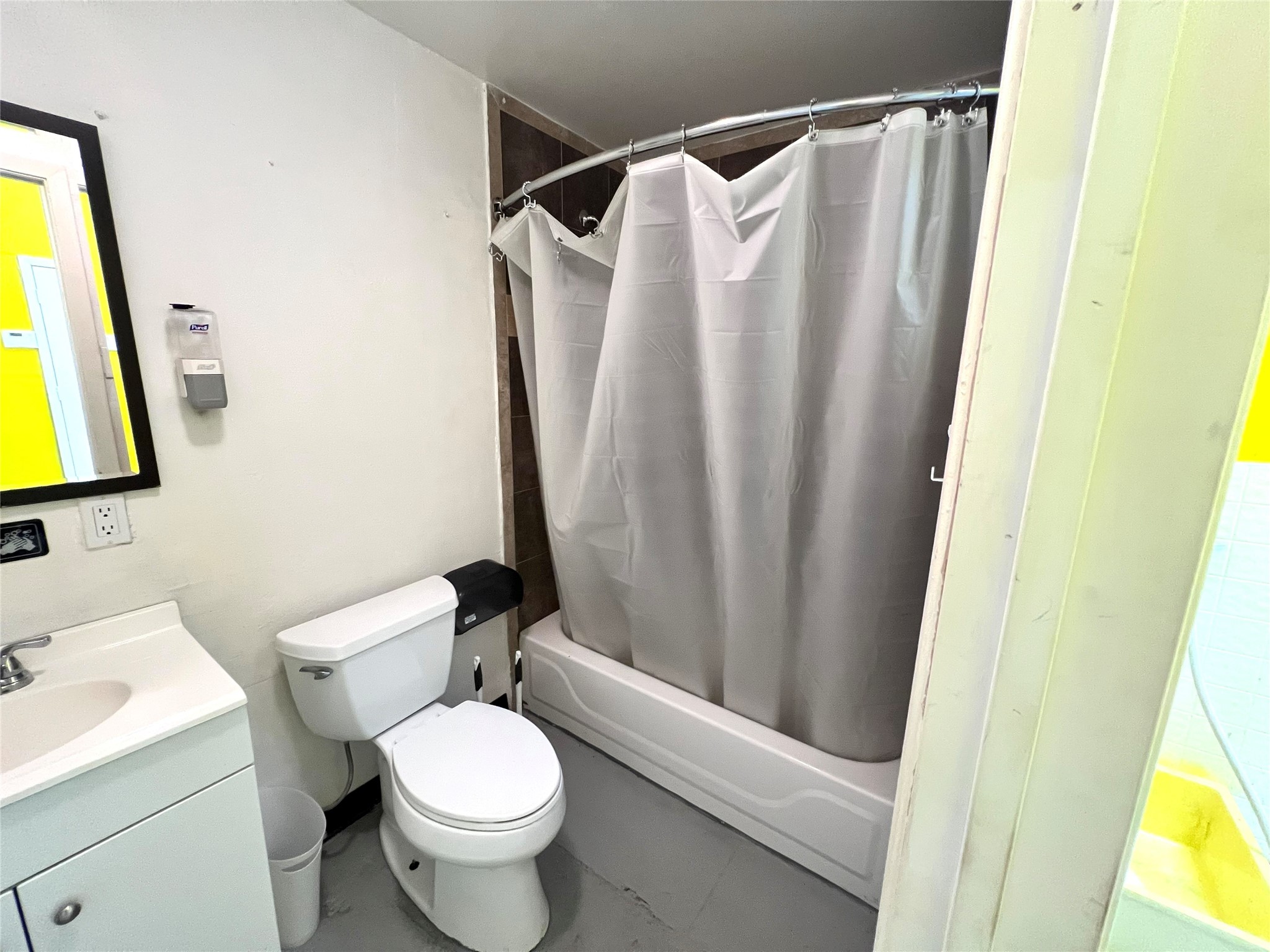 1310 Nance Street, Unit A Houston, TX 77002 - Photo 3 of 18 a white toilet sitting next to a bathroom sink