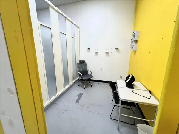 a view of a bathroom with a tub and shower