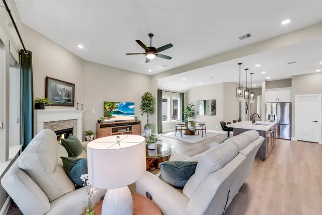 a living room with fireplace furniture and a flat screen tv
