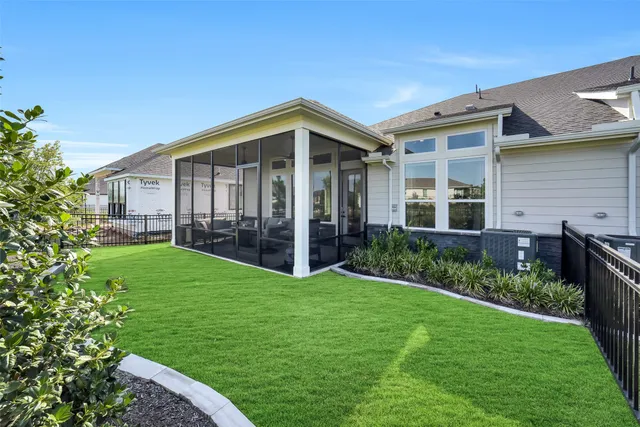 a view of front of house with a yard