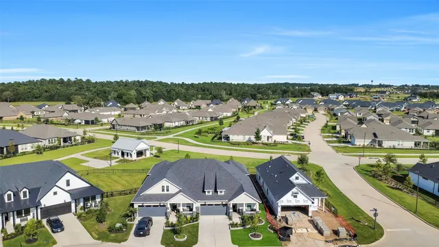 an aerial view of a house with a swimming pool