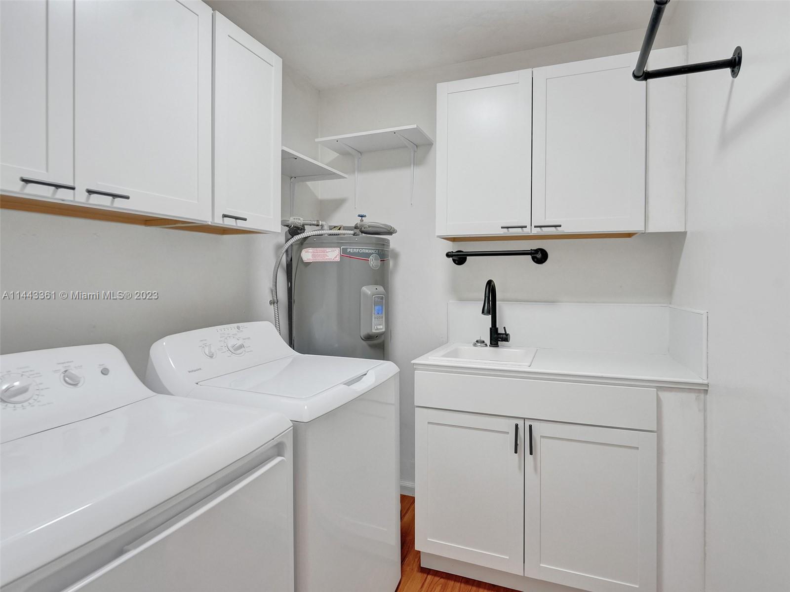 Flamingo Groves Davie, FL 33330 - Photo 37 of 43 a utility room with dryer and washer