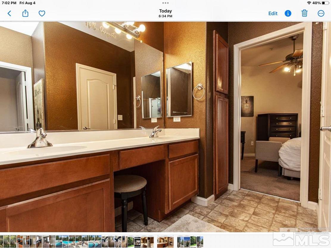 9050 Double R Boulevard, Unit 1024 Reno, NV 89521 - Photo 18 of 32 a bathroom with a sink and a mirror