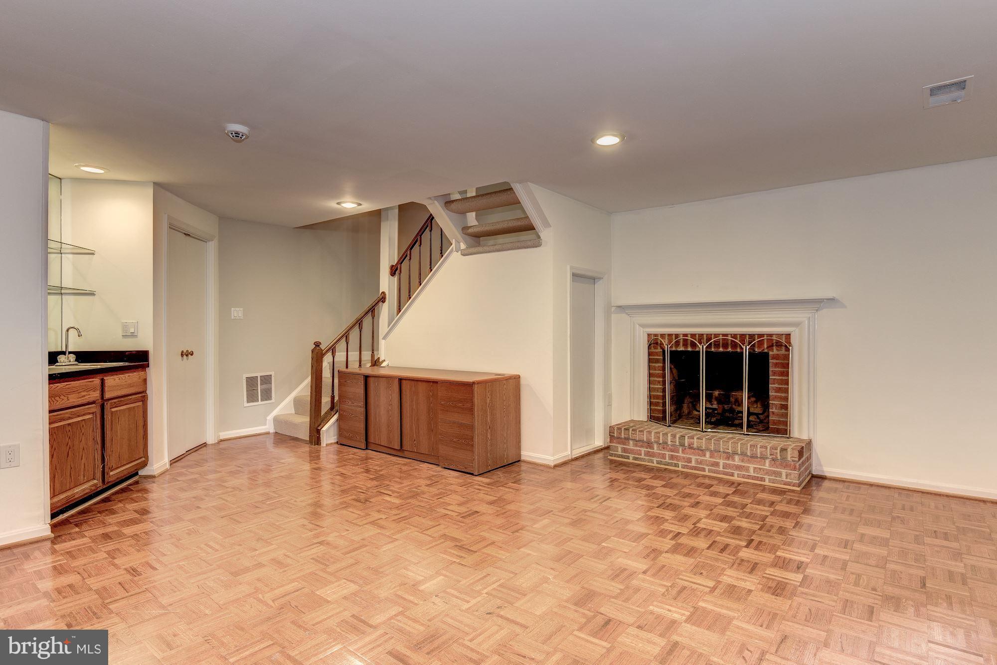 11943 Sentinel Point Court Reston, VA 20191 - Photo 22 of 27 Walk-Out Basement with FP and Wood Parquet Floors