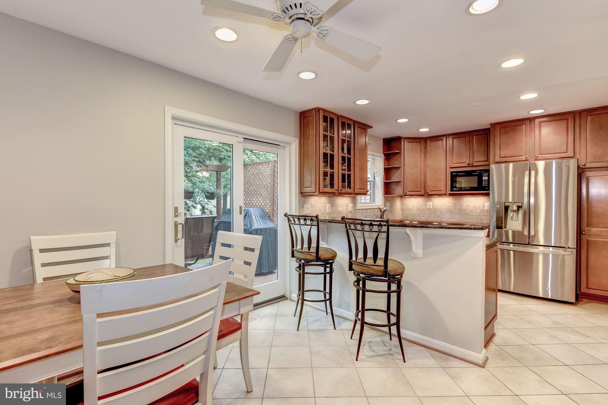 11943 Sentinel Point Court Reston, VA 20191 - Photo 9 of 27 Table Space Off Kitchen & SGD to Deck