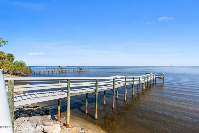a view of a room with wooden floor and chair