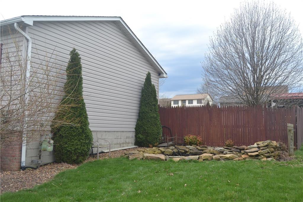 2202 Loucks Road Scottdale, PA 15683 - Photo 3 of 19 Side of house with fish pond.