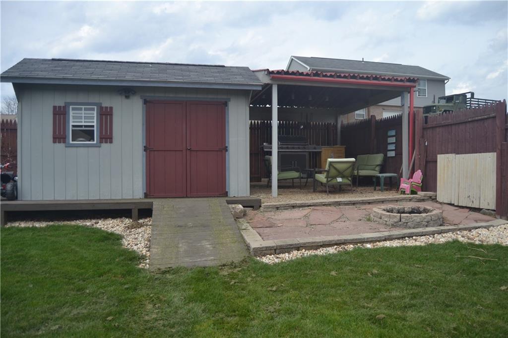 2202 Loucks Road Scottdale, PA 15683 - Photo 5 of 19 Shed with electrical service and covered lounge area with stone fire pit.