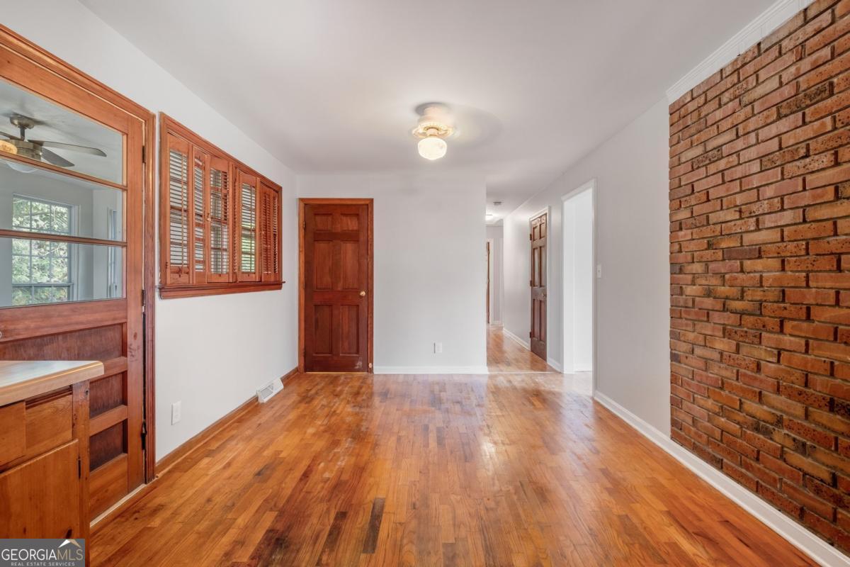 14 Mitchell Circle Rome, GA 30161 - Photo 26 of 39 a view of a hallway with wooden floor and staircase