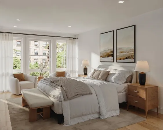 a bedroom with a bed and large window
