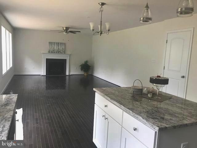 8363 WB&A Road Severn, MD 21144 - Photo 4 of 32 a kitchen with kitchen island a counter space a sink and appliances