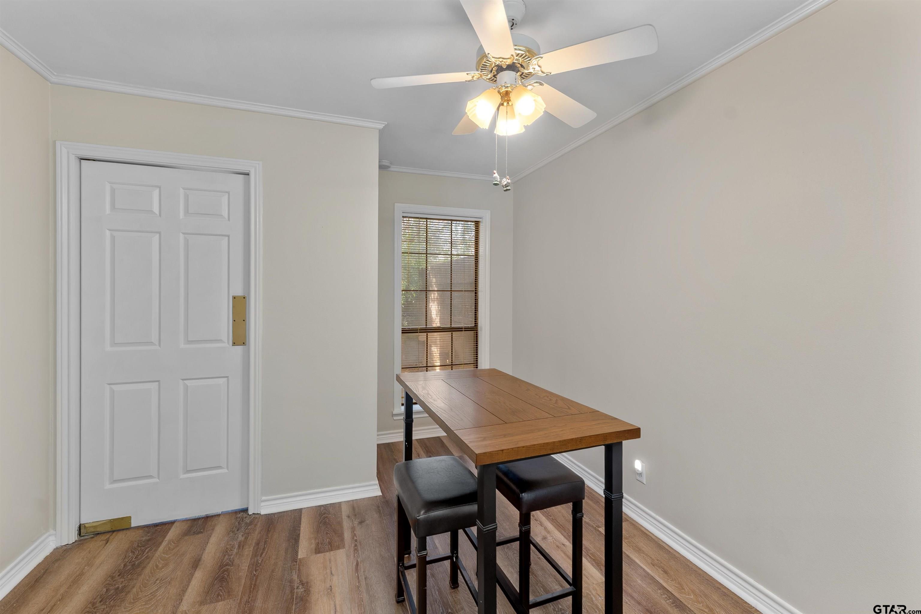 509 Buckingham Place Tyler, TX 75701 - Photo 11 of 35 a view of a dining room with furniture and wooden floor