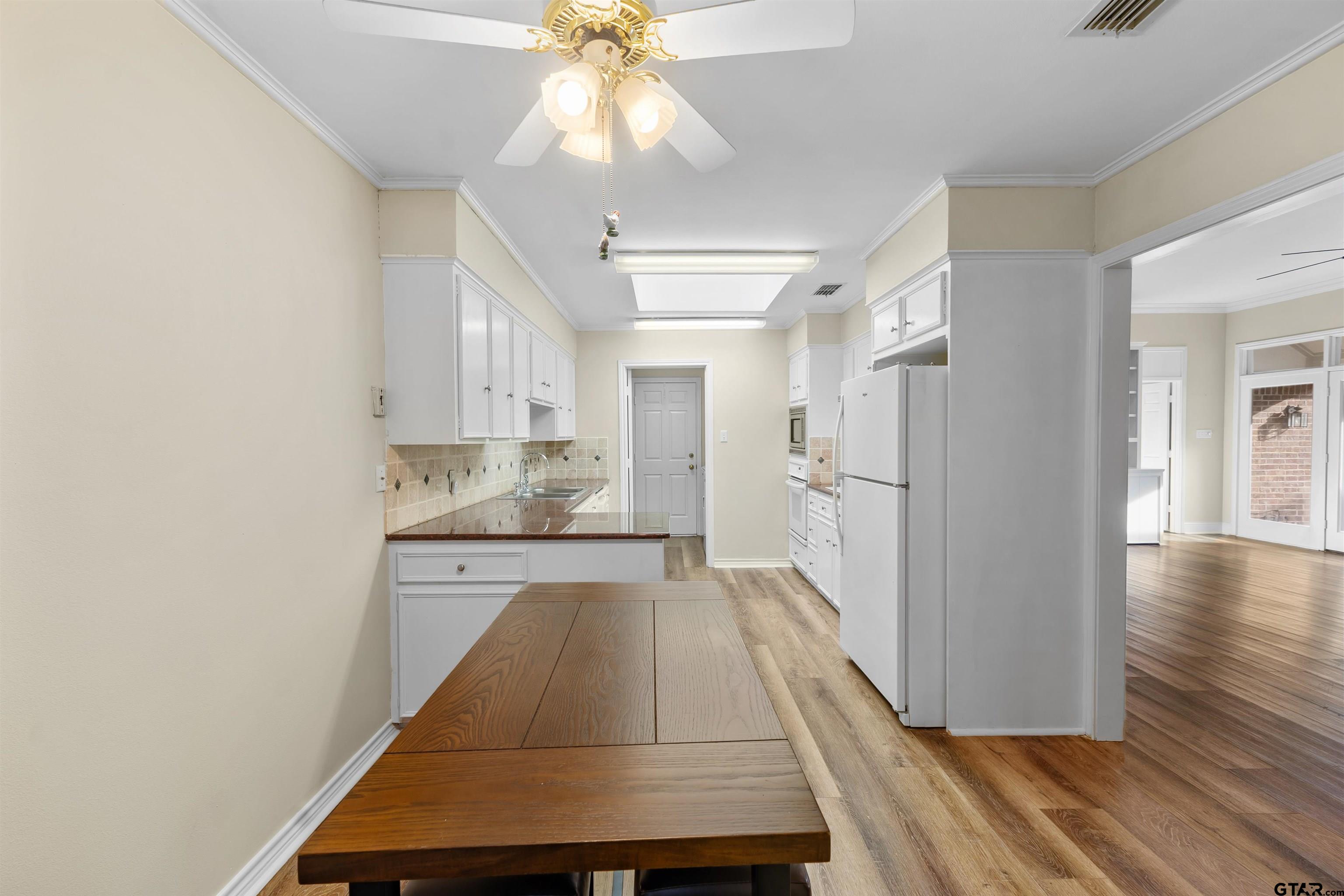 509 Buckingham Place Tyler, TX 75701 - Photo 12 of 35 a view of a kitchen from the hallway