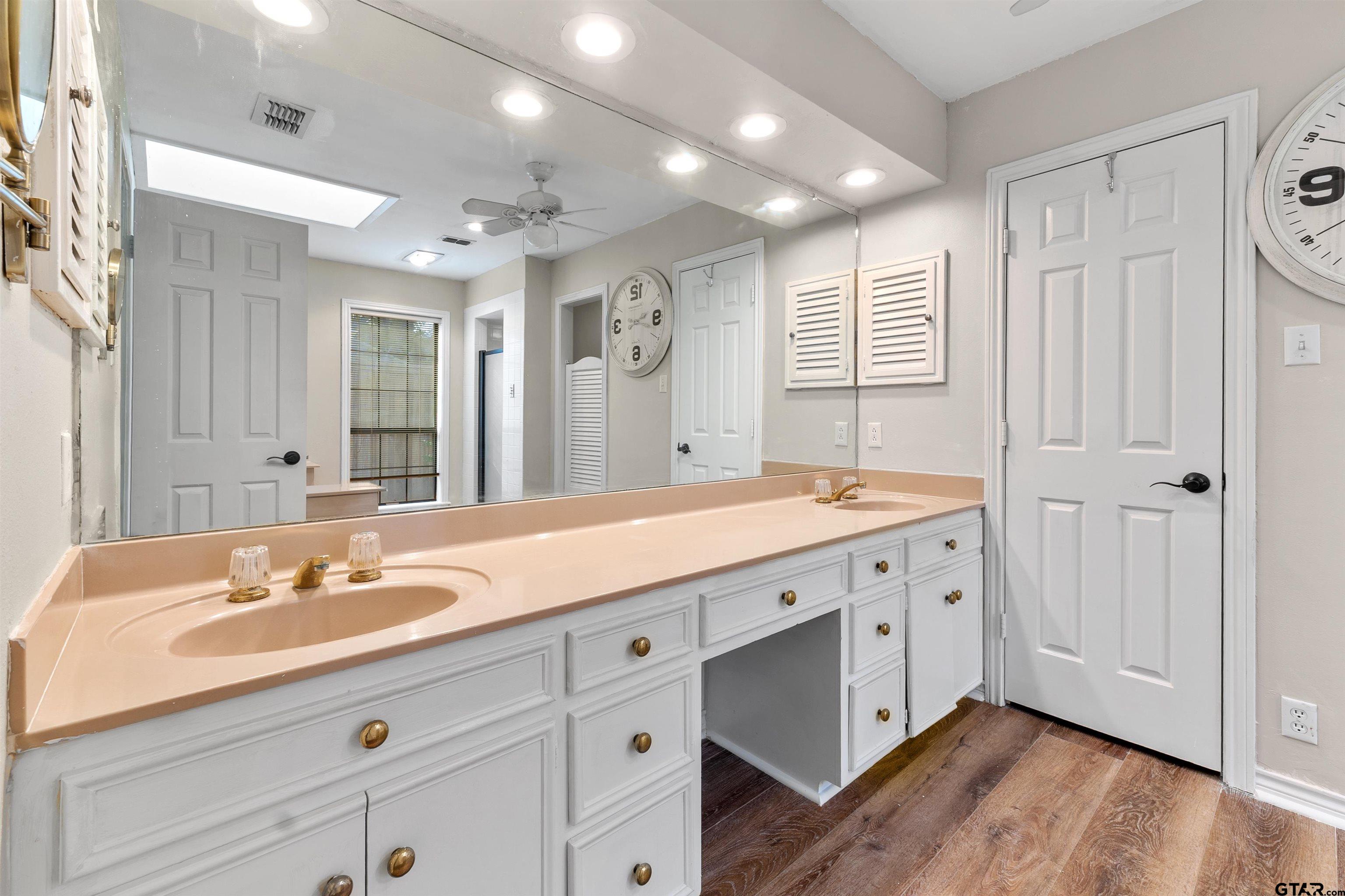 509 Buckingham Place Tyler, TX 75701 - Photo 19 of 35 a spacious bathroom with a double vanity sink mirror and