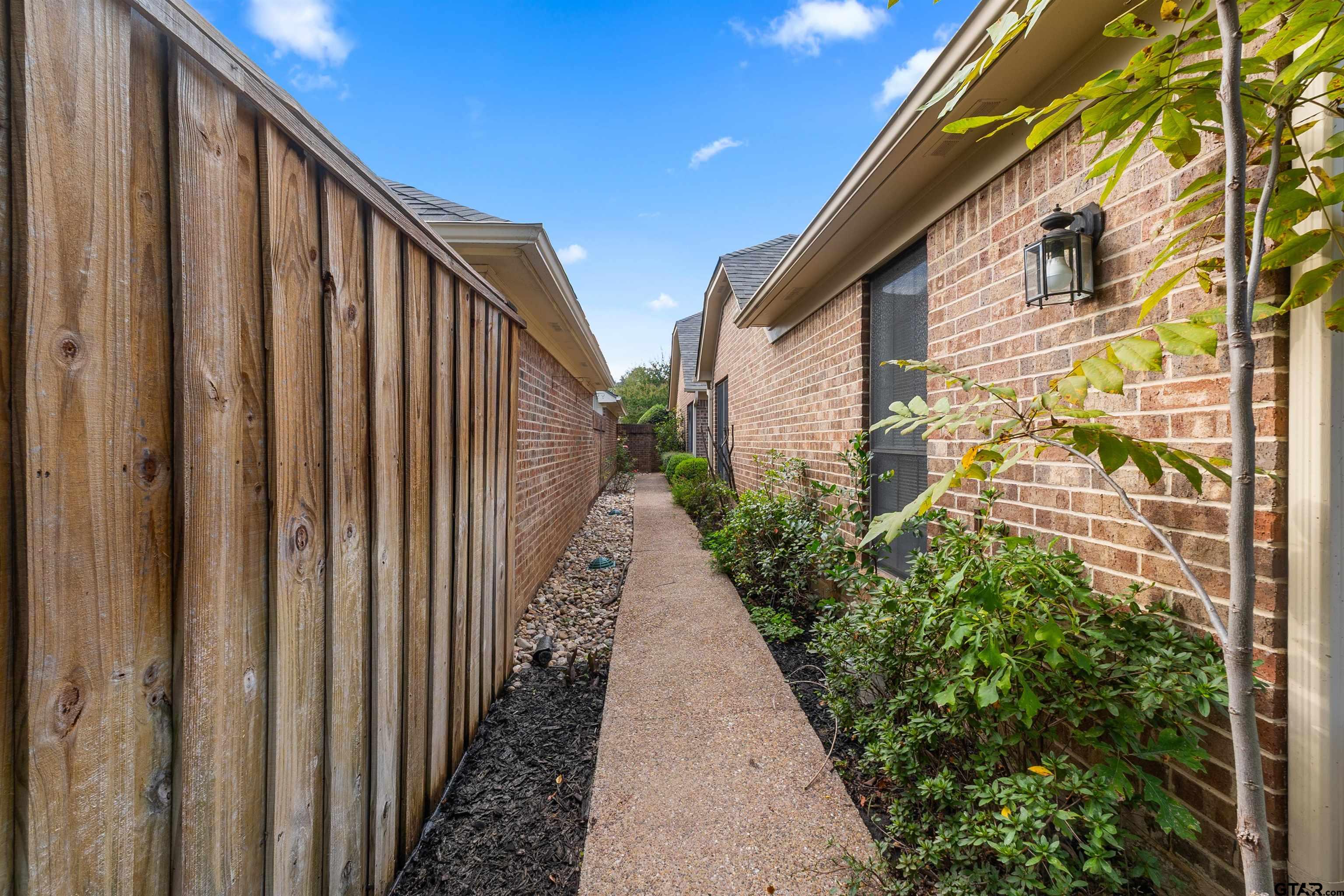 509 Buckingham Place Tyler, TX 75701 - Photo 33 of 35 a view of a pathway of a building