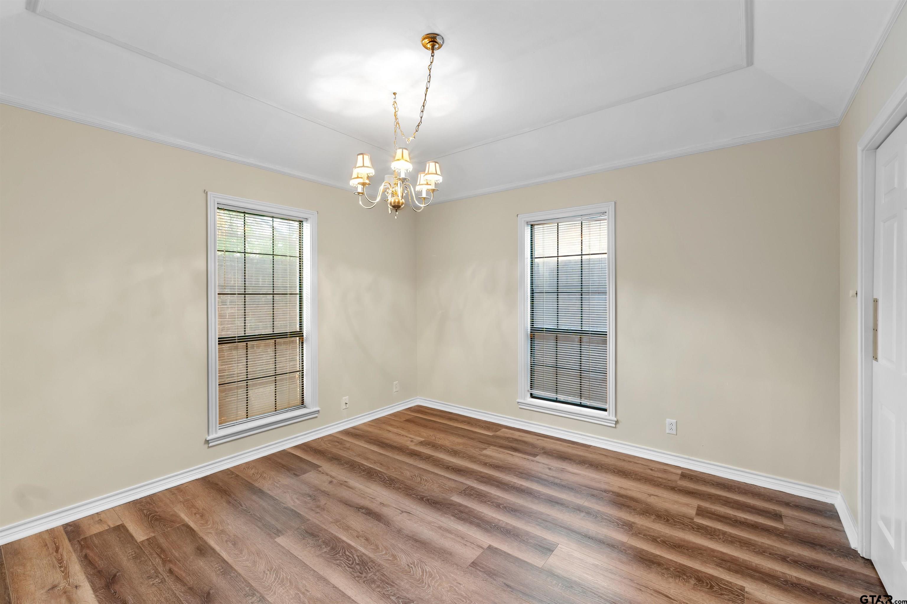 509 Buckingham Place Tyler, TX 75701 - Photo 10 of 35 a view of empty room with wooden floor and fan