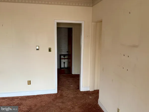 a view of an empty room and fire place