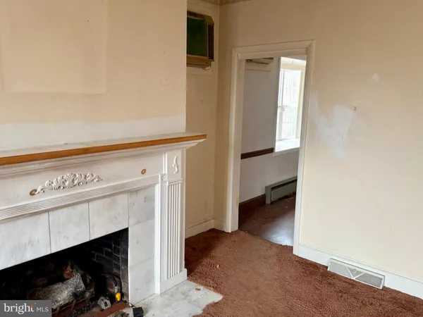 a kitchen with white cabinets and appliances
