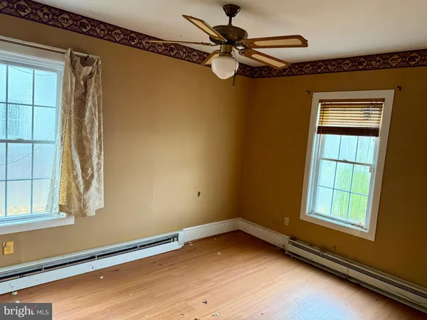 a view of empty room with windows