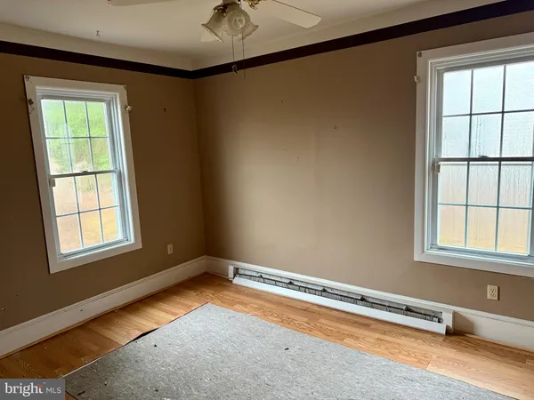 a view of front door with wooden floor