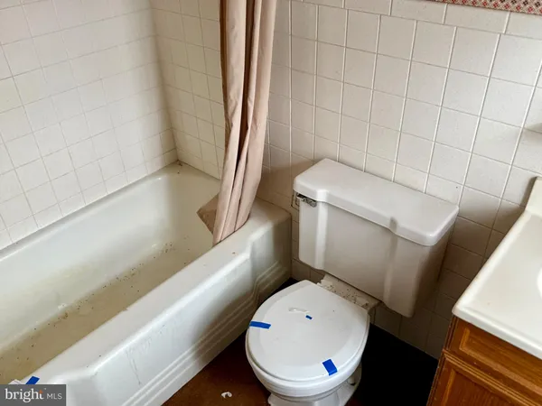 a bathroom with a sink and a window