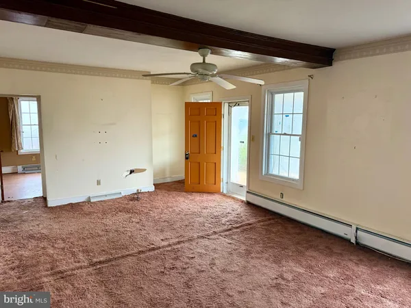 a view of an empty room and window